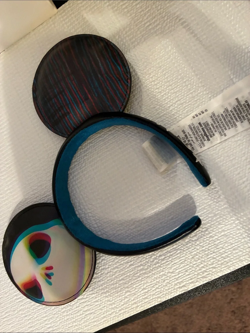 Disney Black Headband with Teal Lining and Multicolor Skull Ears